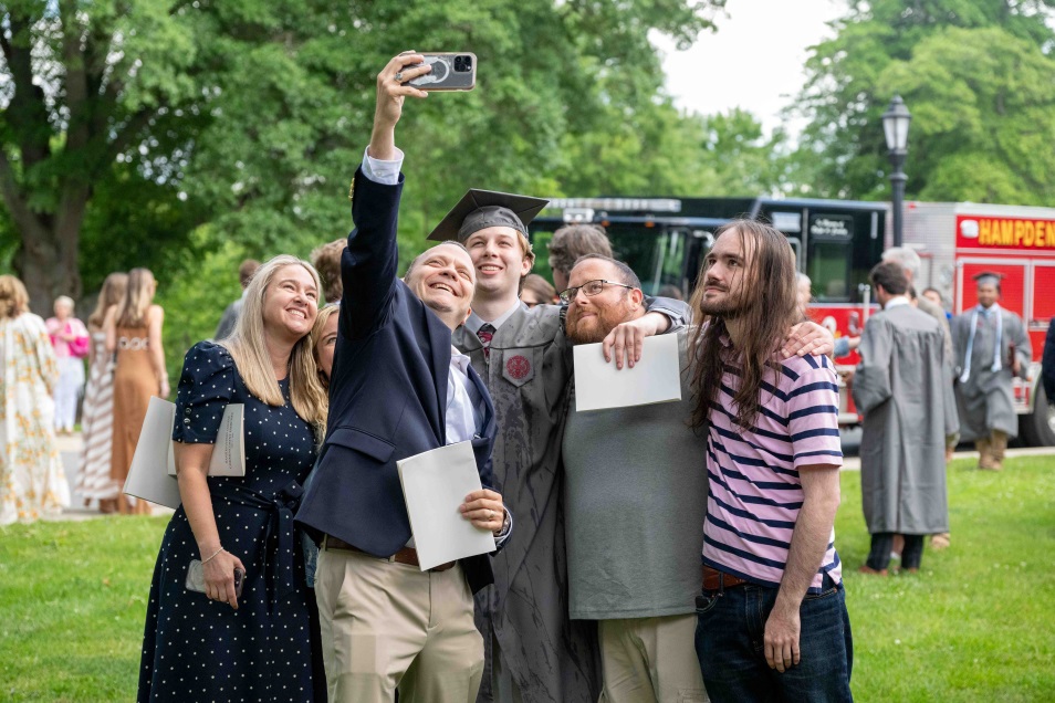 family taking a selfie after commencement