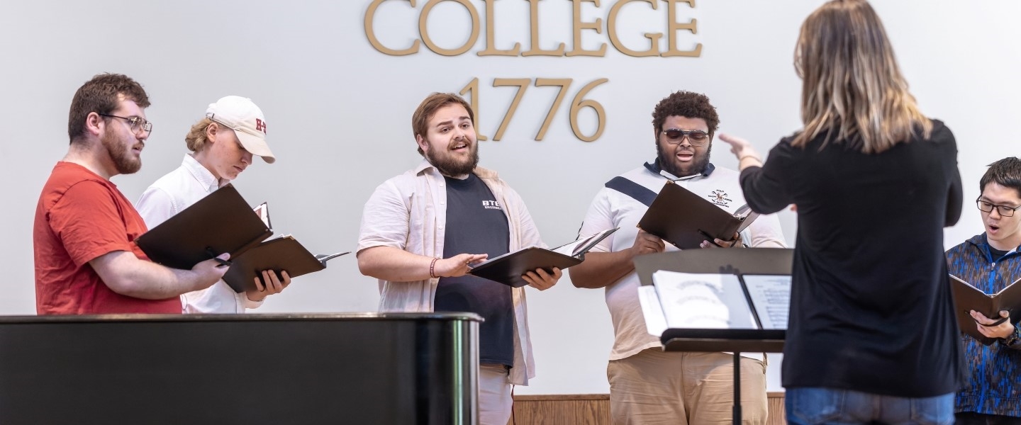 Professor von Rueden directing a choral group