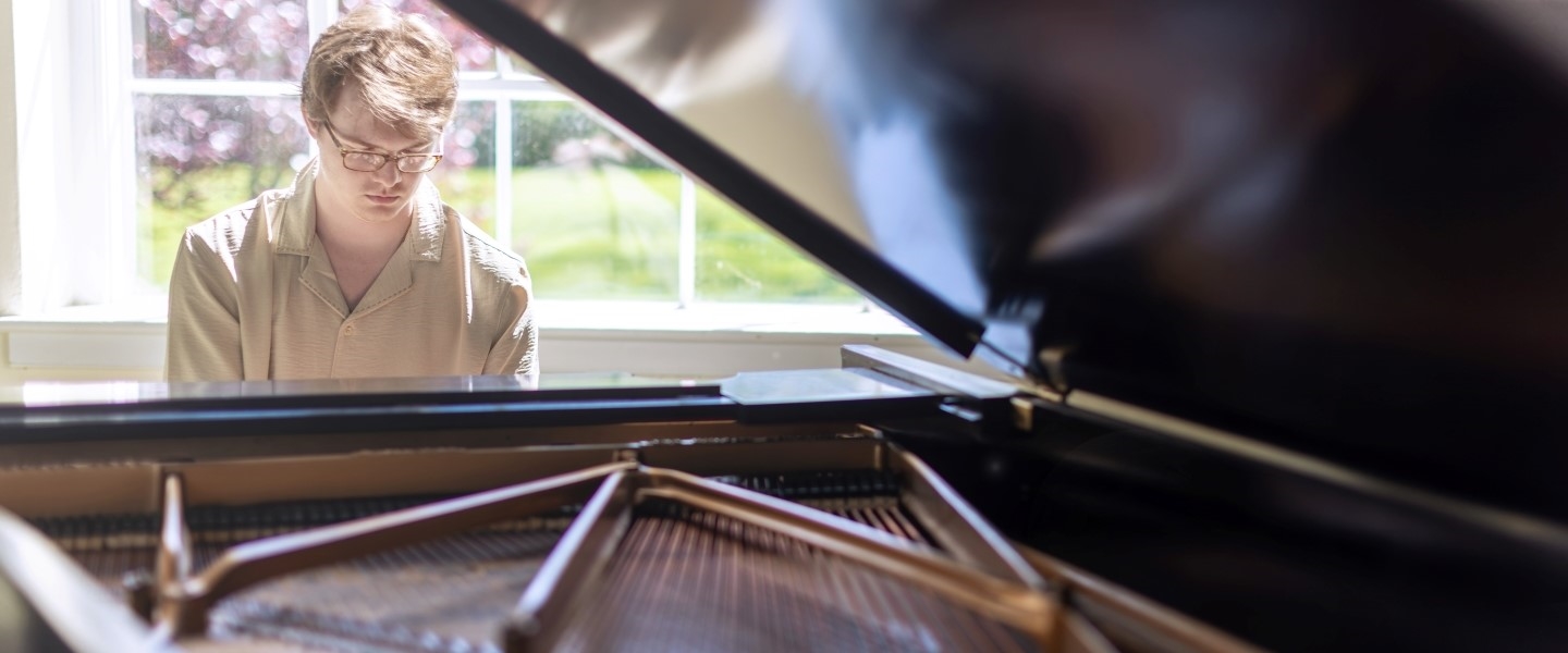 Student playing a piano at Hampden-Sydney College