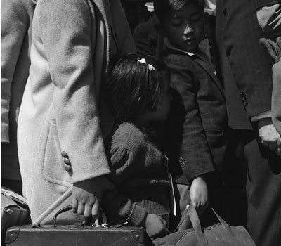 Historical Photograph of Japanese family with suitcases