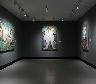art exhibit with paintings