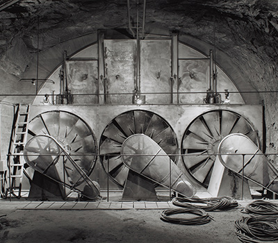 black and white industrial photograph of wind turbines