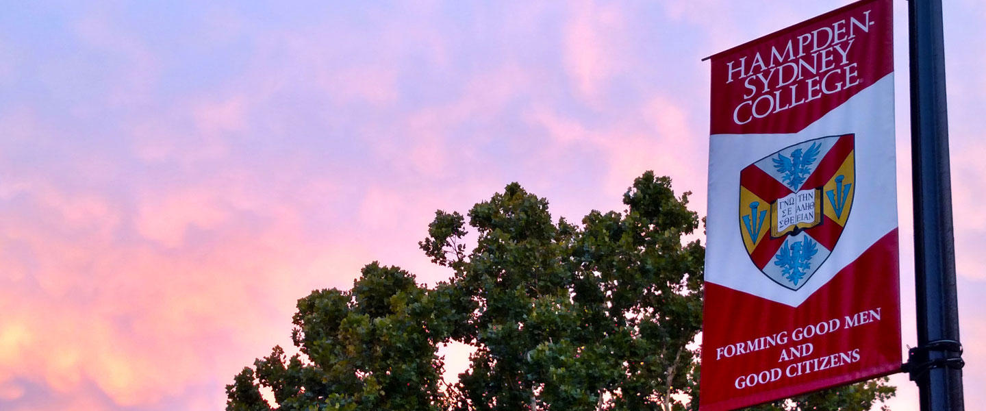 Hampden-Sydney College banner flying in the sunset 