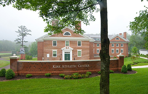 The front of Kirk Athletic Center, a large brick campus building