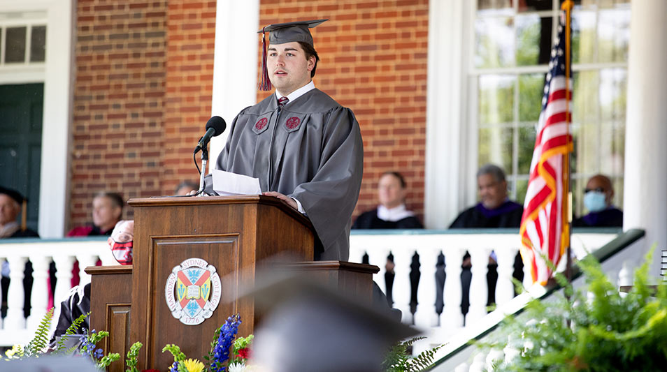 Tyler Howerton '21 addresses the student body at the podium