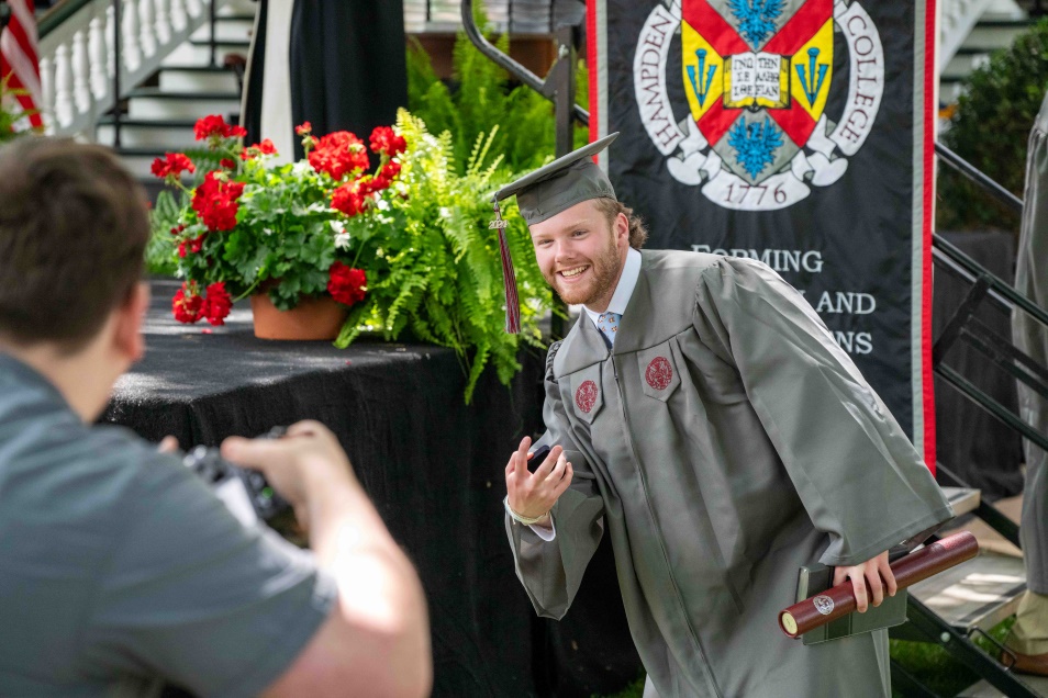 excited graduate smiling at commencement