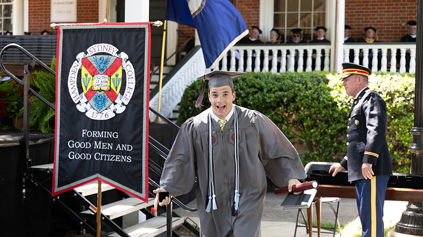 an excited graduate getting his degree