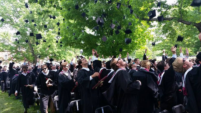 New graduates throw their caps