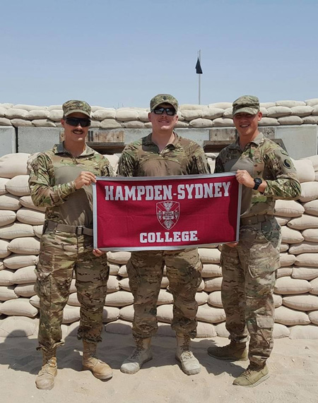 Bobby George '17 with two Hampden-Sydney brothers in Qatar