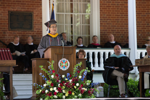 image of James Lau, valedictorian, giving a speech to the graduating class