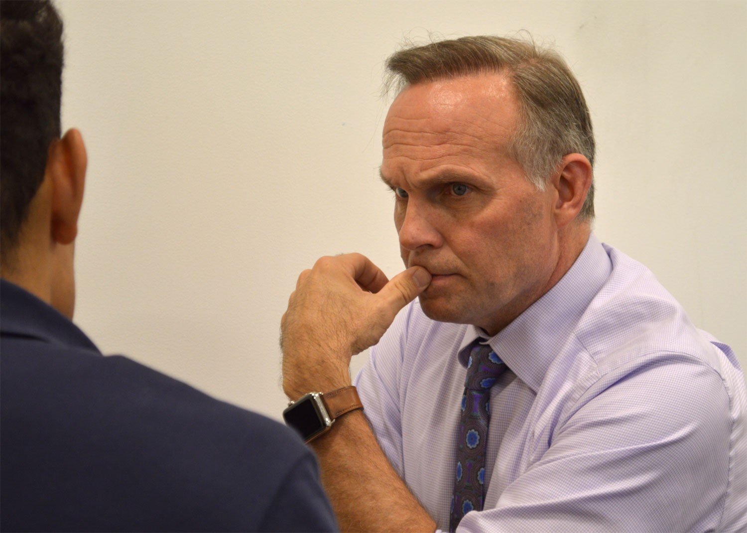 Daniel Morris, Entrepreneur in Residence, listens to a student.