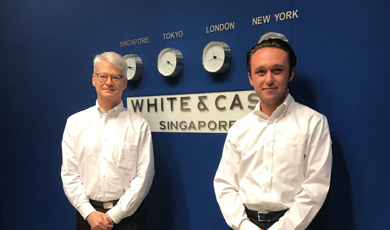 Barrye Wall '78 and Zane Moody '18 at the White & Case Singapore office.