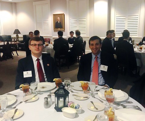 Two students attend the Etiquette Dinner
