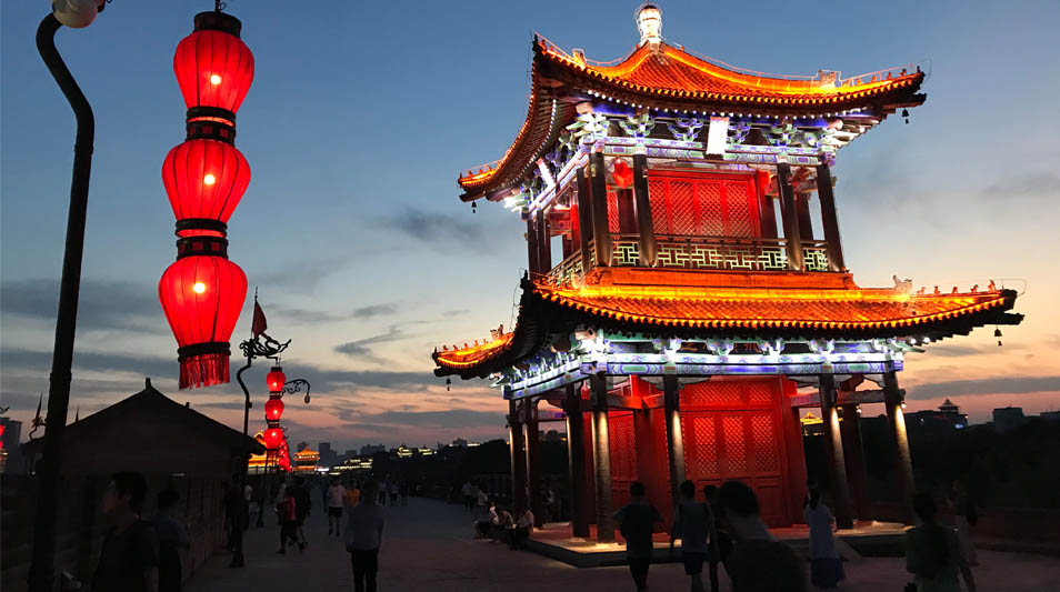 A building in front of a sunset in colorful Xi'an, China.