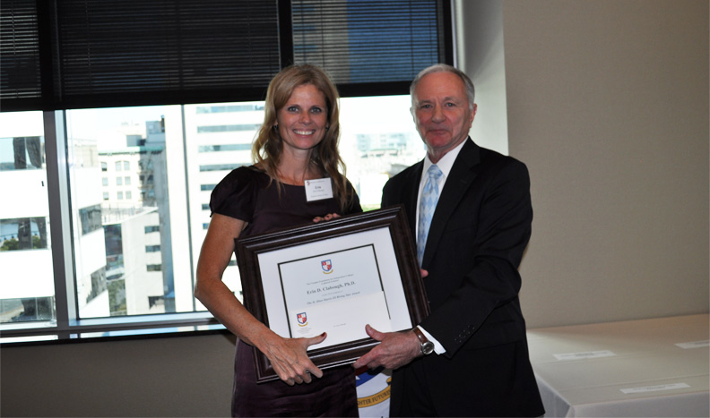 Erin Clabough being presented the Rising Star Award at the VFIC office.