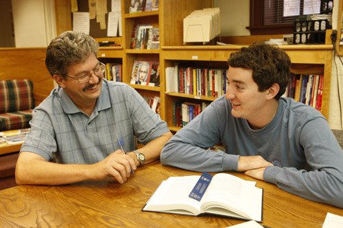Lowell Frye works with a student in the writing center