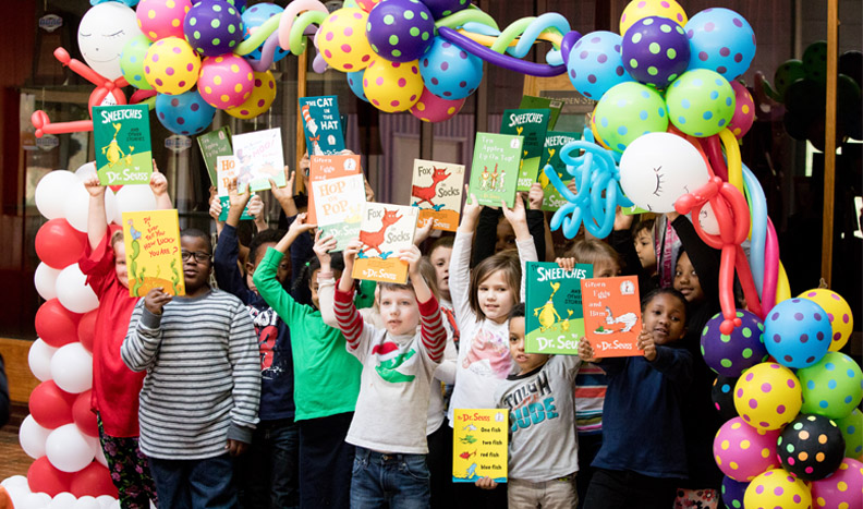 Second graders show off their books at the Dr. Seuss Birthday Bash