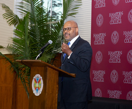 The Honorable Maurice Jones, keynote speaker at MAM weekend in front of a podium at Hampden-Sydney College