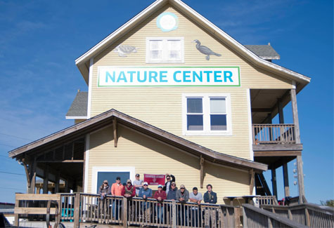 A group of Hampden-Sydney students pose in front of the Hatteras Island Ocean Center