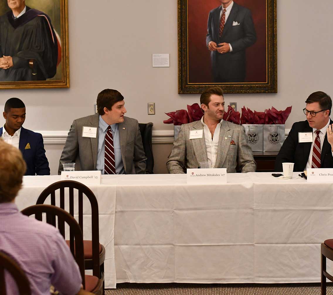 Alumni Panelists speak to a crowd in Pannill Hall