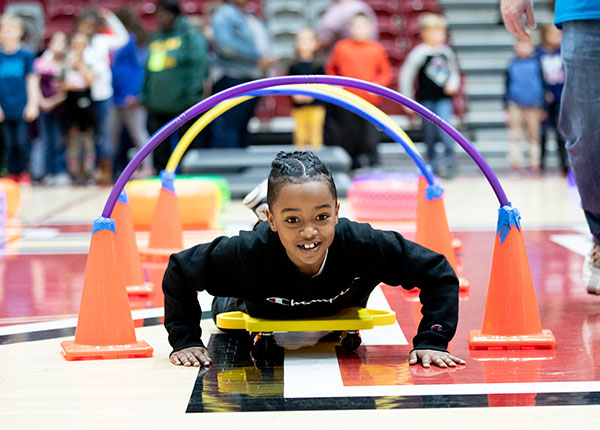 a boy moving through an abstacle course