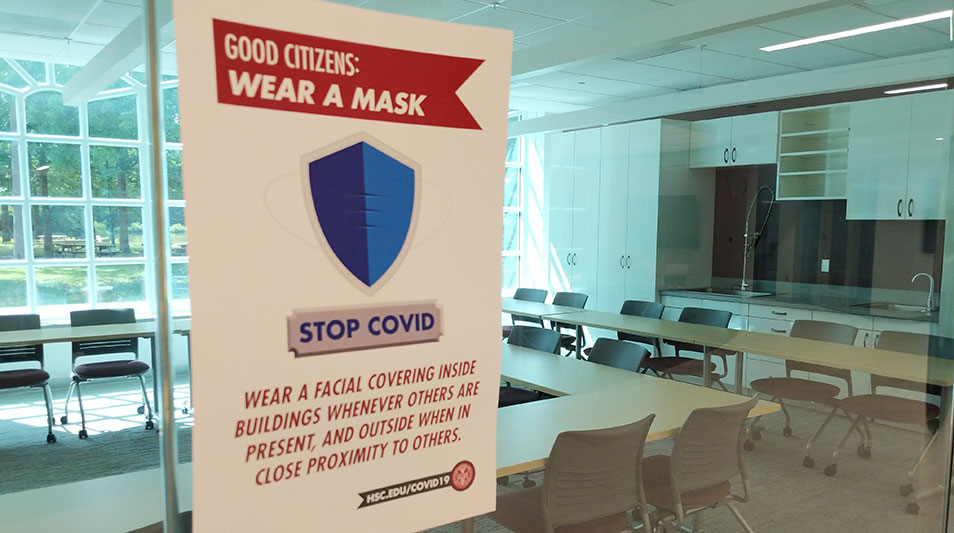 a poster reminding everyone to wear a mask