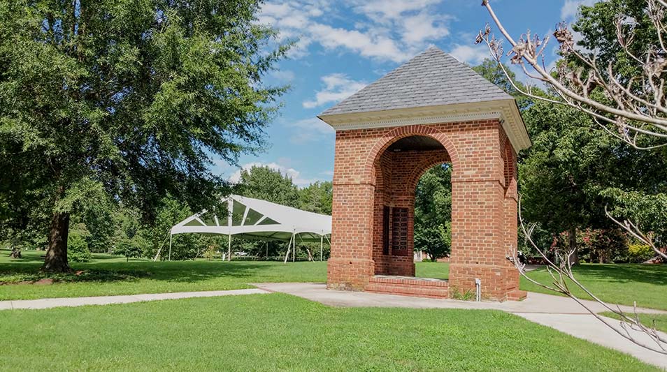 A large tent awaits students behind the Bell Tower