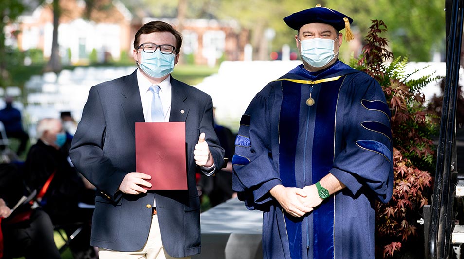 Hampden-Sydney student and professor posing for a photo