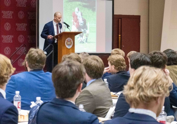 Students at the One Brotherhood dinner listening to their speaker