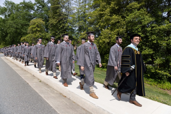 Dean Pantele leading the class of 2025 to convocation