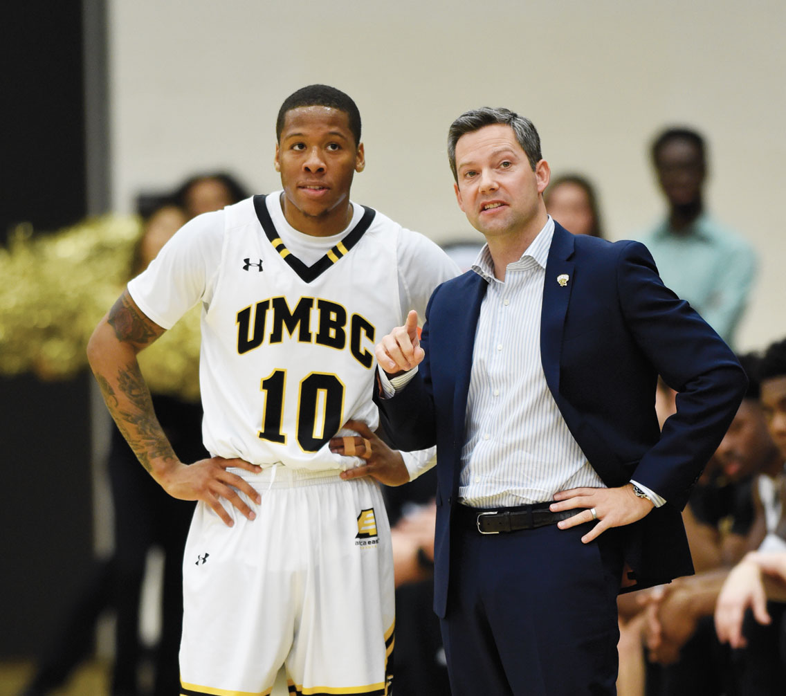 Jairus Lyles listens to coach Ryan Odom