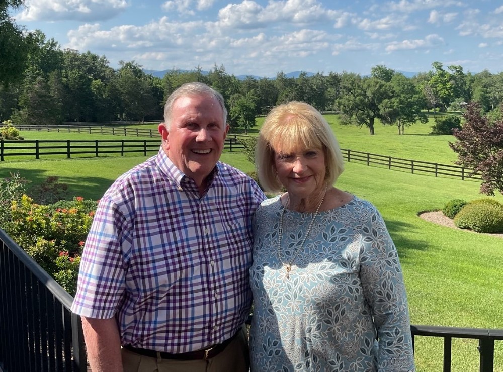 Wally Nunley ’69 with his wife and the mountains behind them