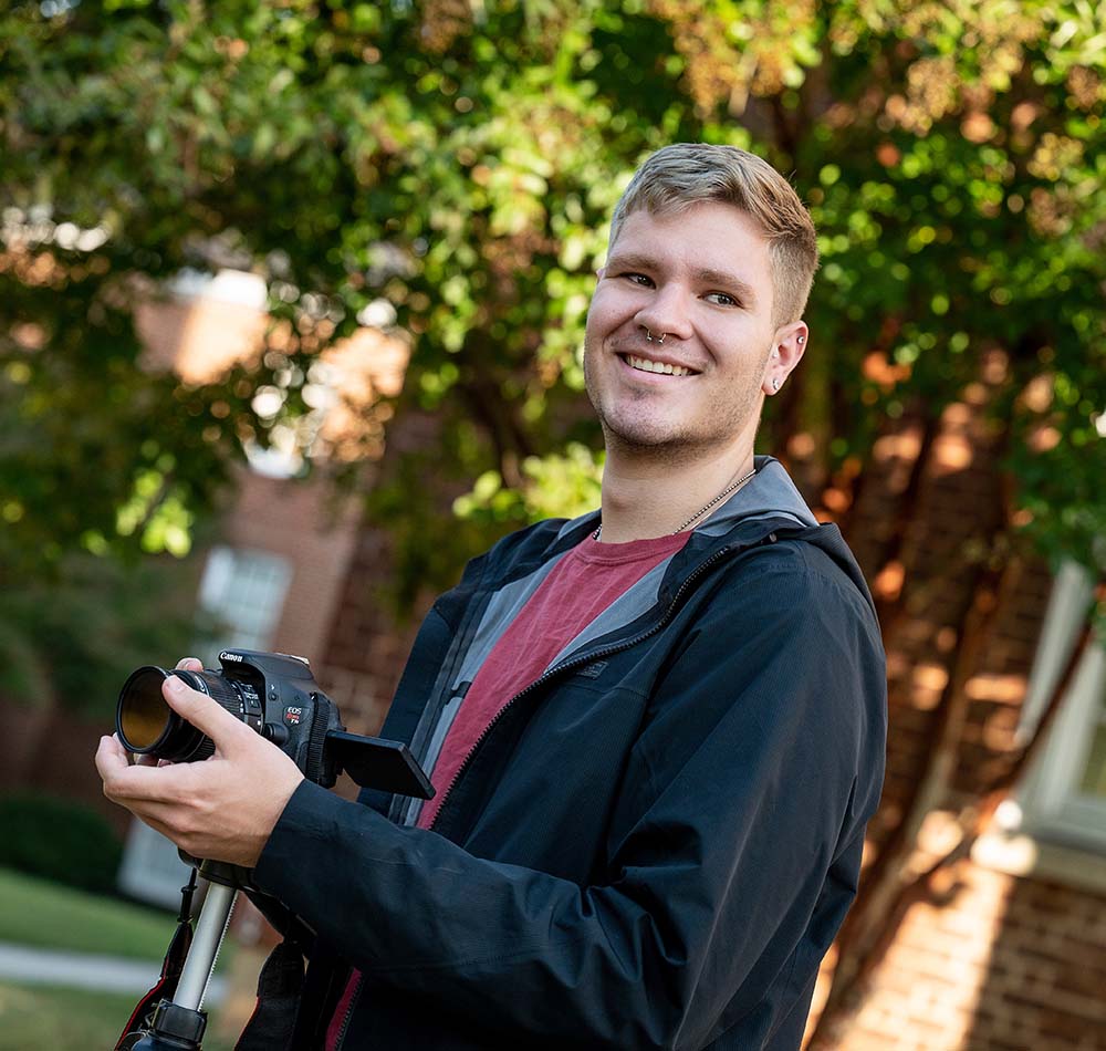 Joey Kelly holding a camera