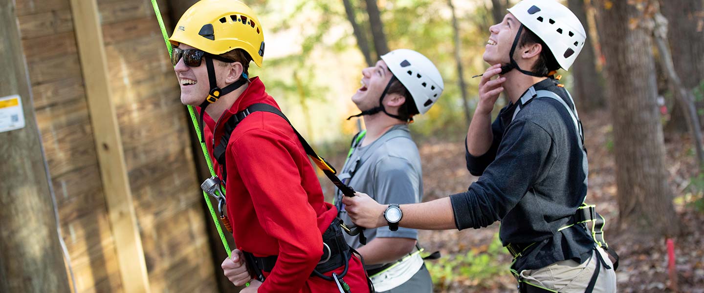 Student navigating the suspended ropes course at Hampden-Sydney College