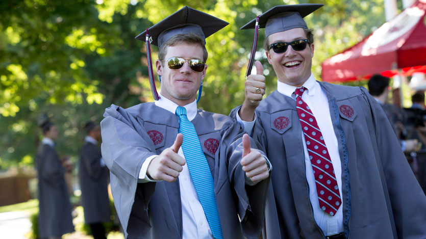 Hampden-Sydney graduates give a thumbs-up at commencement