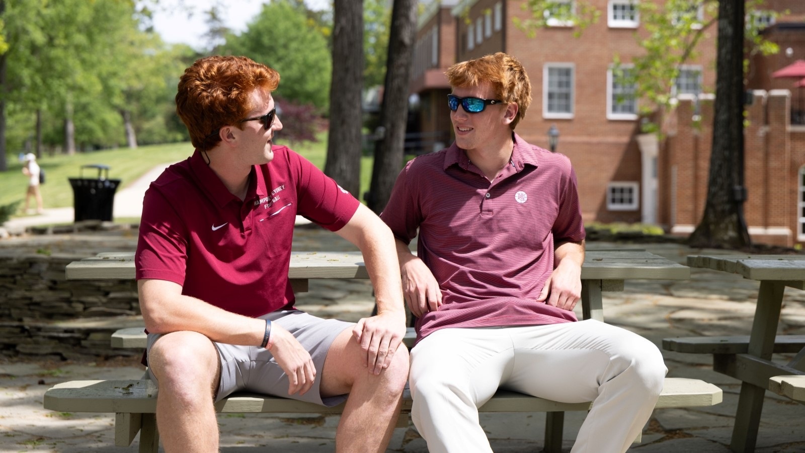 Sutton and Manning Lasso sitting at a picnic table near Lake Chalgrove