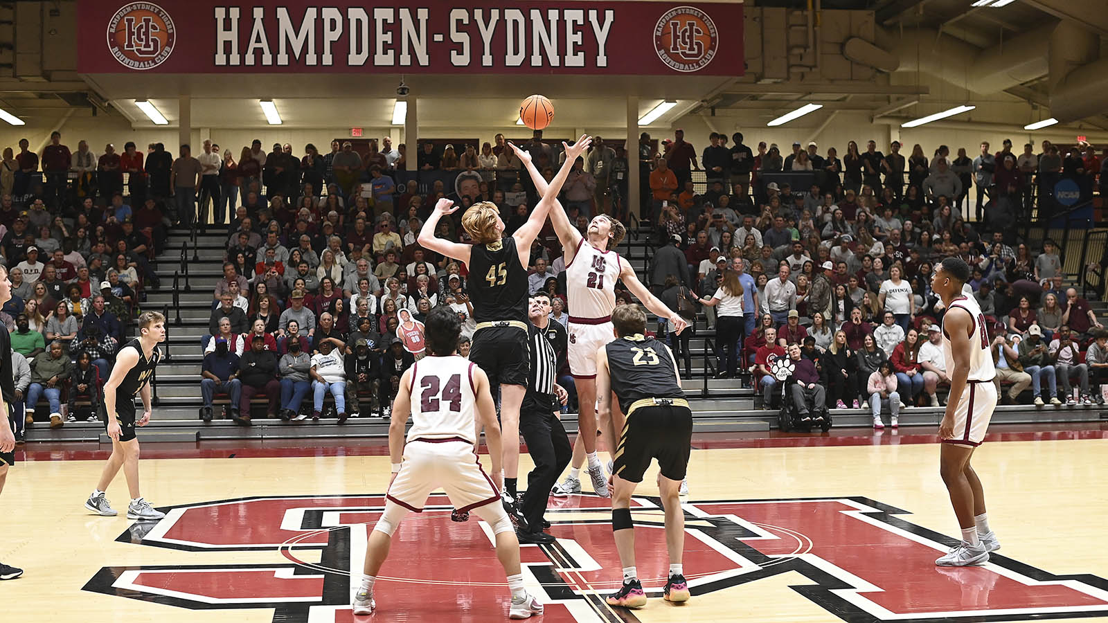 Hampden-Sydney basketball players on the court at the Hampden-Sydney College fieldhouse