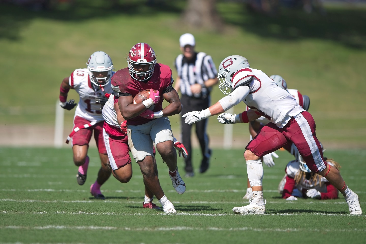 Hampden-Sydney football players running down the field