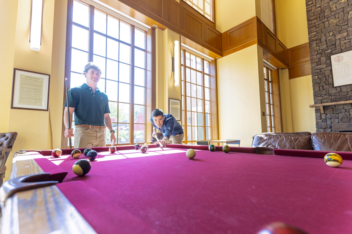 students playing pool in the Brown student center