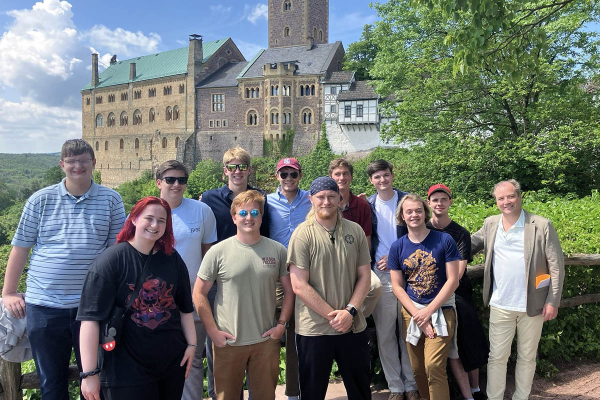 students standing in front of a German castle
