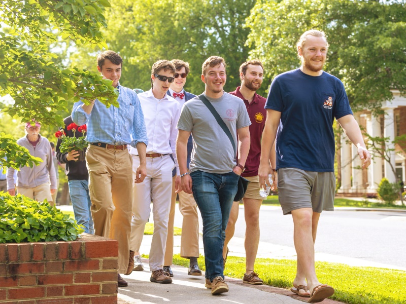 a group of students or visitors walking through campus