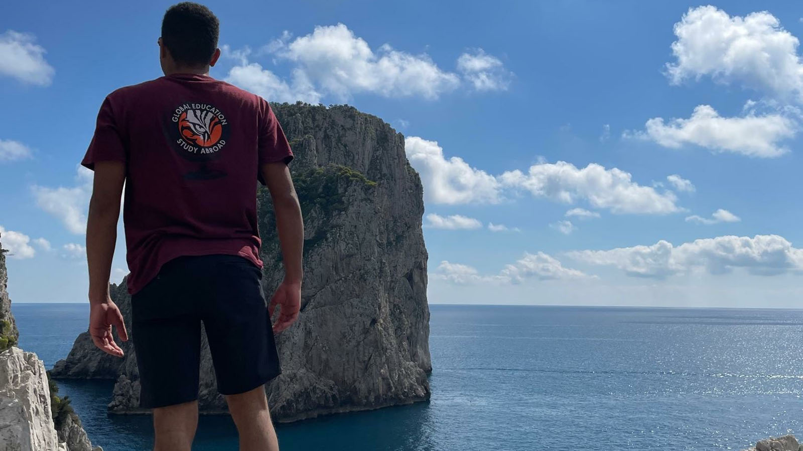 a student overlooking the Pacific Ocean