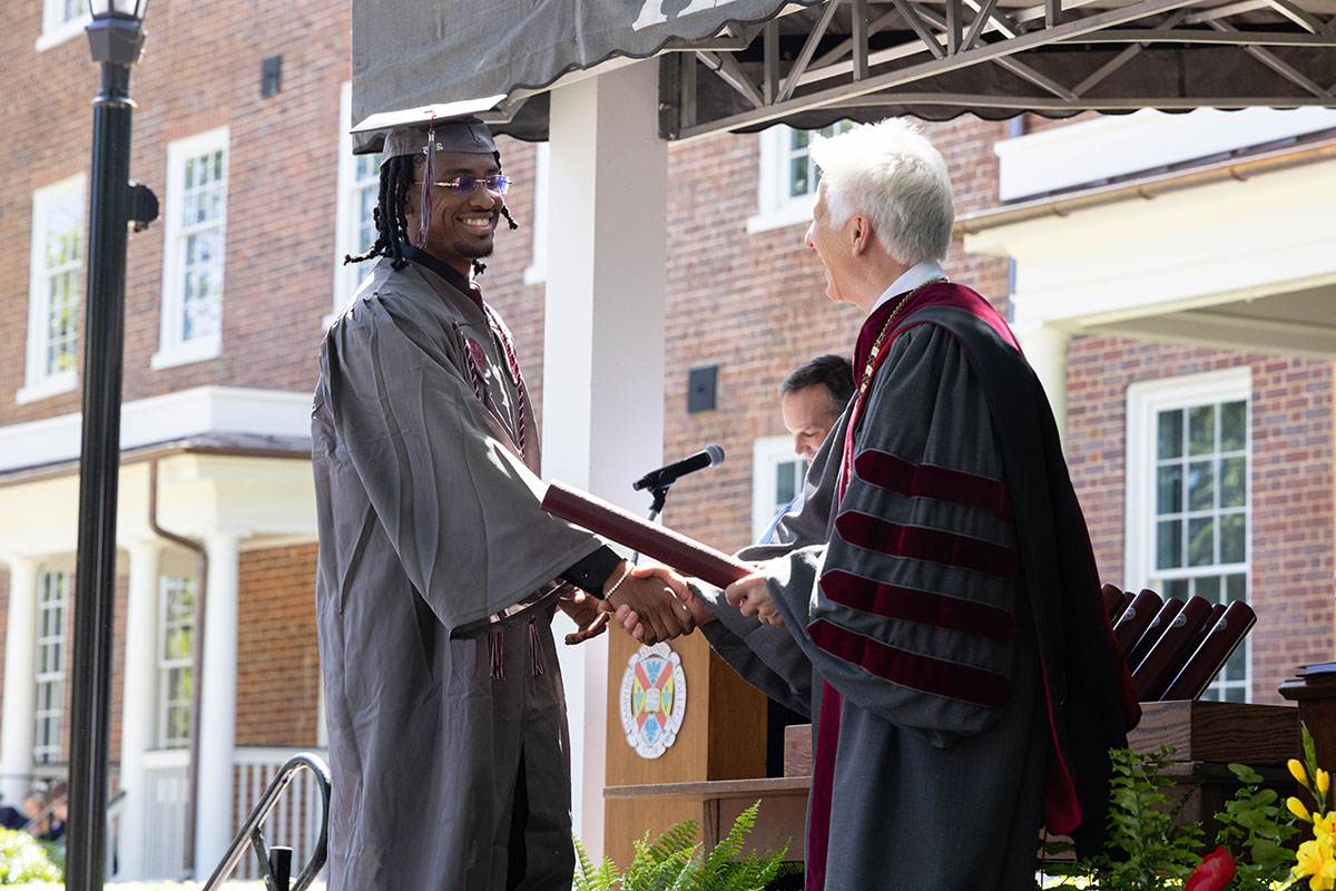 Class of 2025 student receiving his diploma