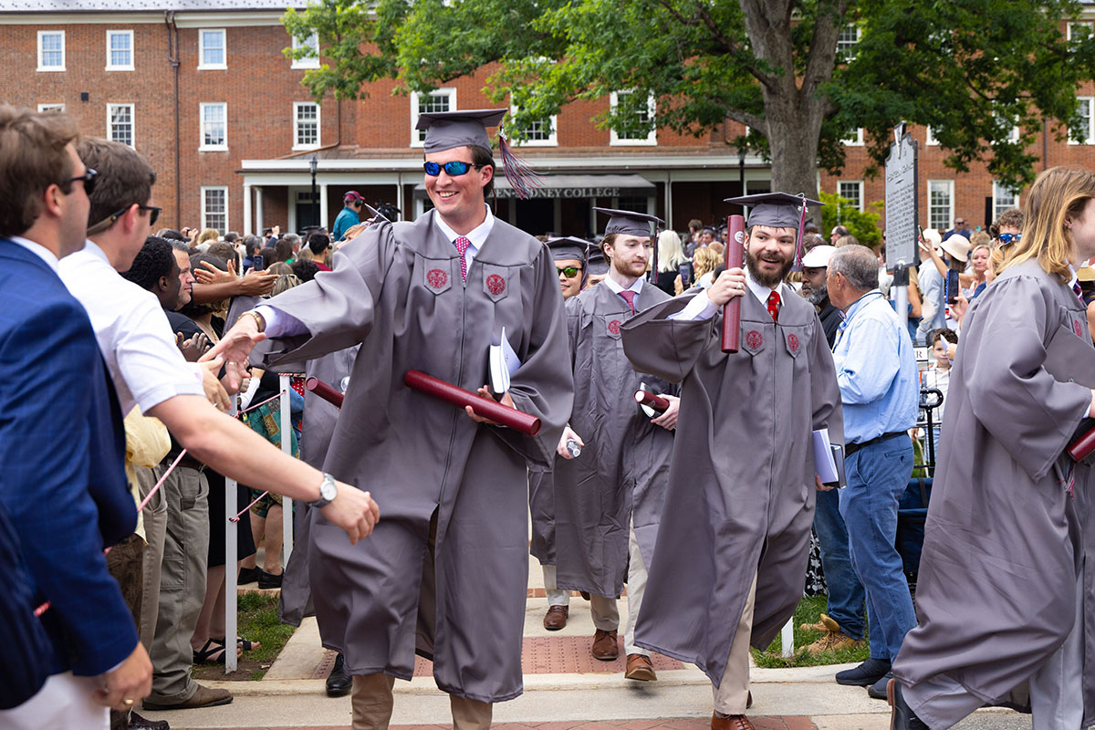 Class of 2026 leaving the commencement ceremony with diplomas in-hand