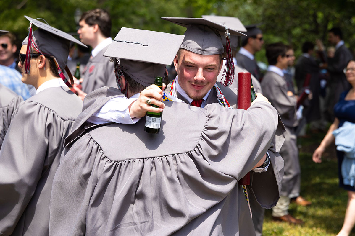 Class of 2026 classmates hugging after the commencement ceremony