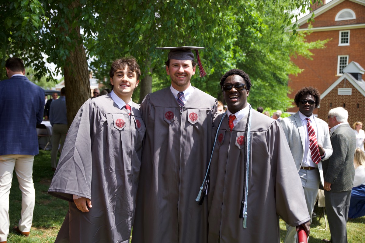Class of 2026 classmates posing together after the commencement ceremony