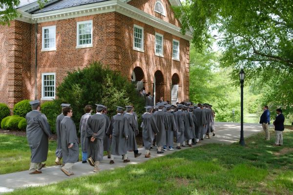 Students processing in regalia at convocation ceremony