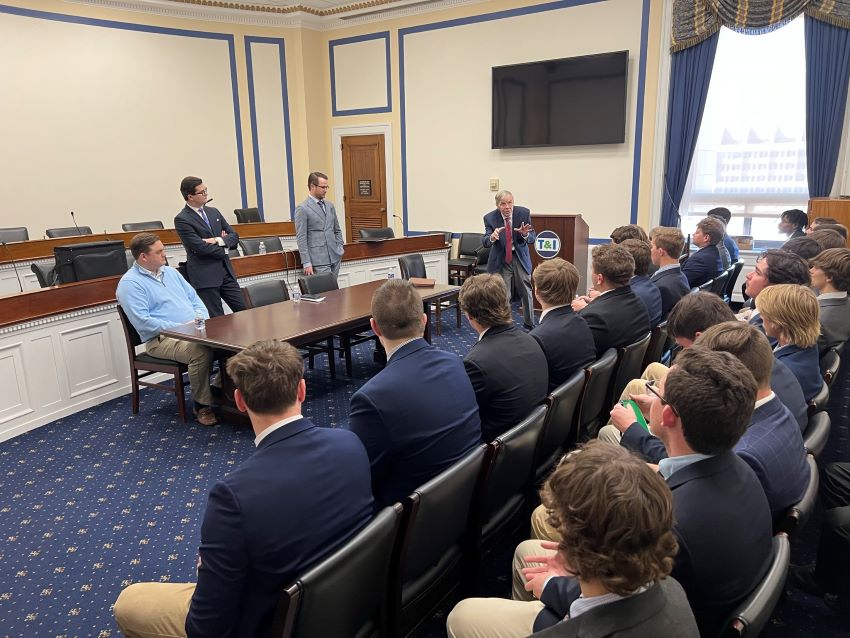 students gathered in a conference room