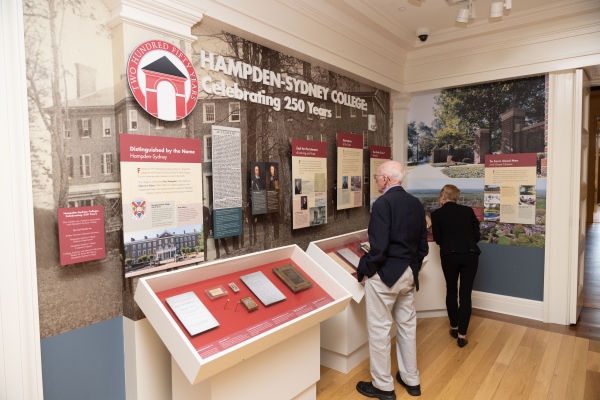 patrons looking at the Hampden-Sydney 250th anniversary exhibit at the Virginia Museum of History and Culture