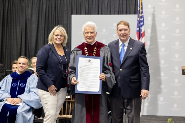 Presiden Stimpert accepting a proclamation at H-SC Founders Day convocation